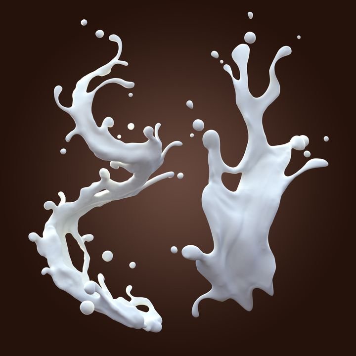 White milk splashes dynamically against a dark brown background, capturing motion and texture.