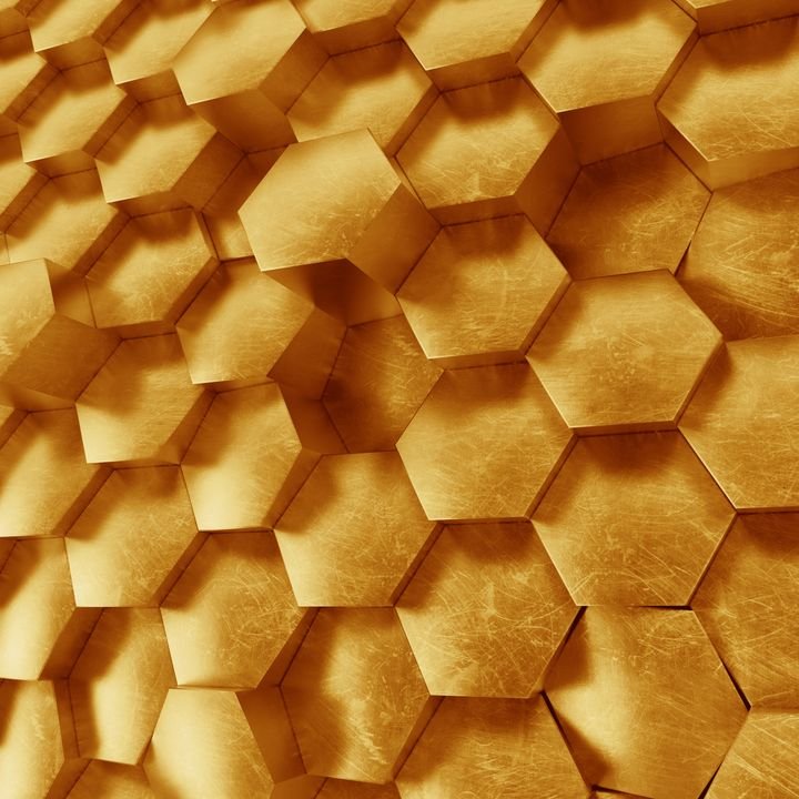 A textured surface of golden hexagonal tiles creates a shimmering, geometric pattern with depth and metallic sheen.
