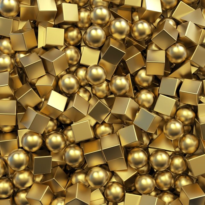 A chaotic pile of shiny gold cubes and spheres fills the frame, creating a rich, metallic texture.