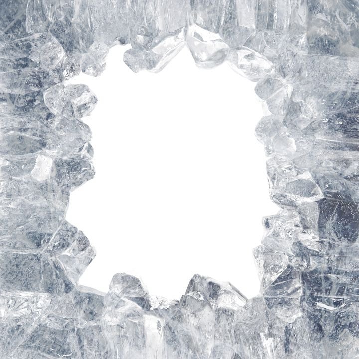 A jagged frame of clear ice crystals surrounds a bright white center, showcasing sharp textures and frosty details.