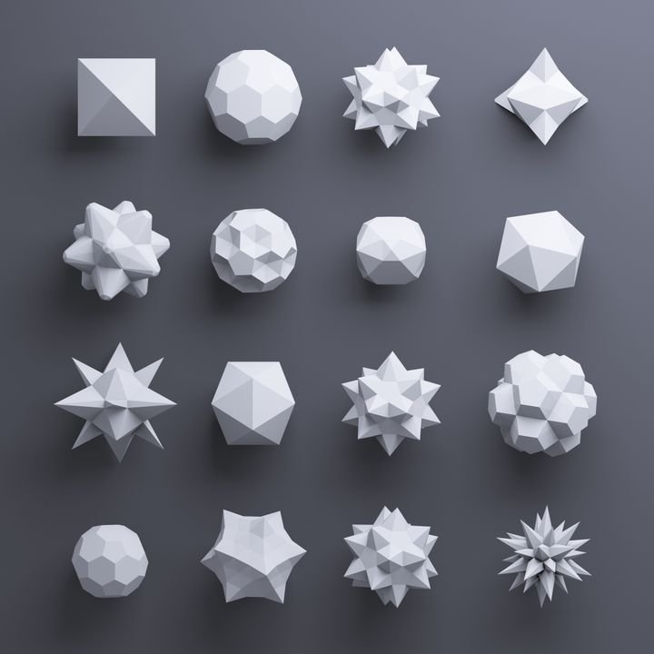 A collection of white geometric shapes arranged in a grid on a dark background.