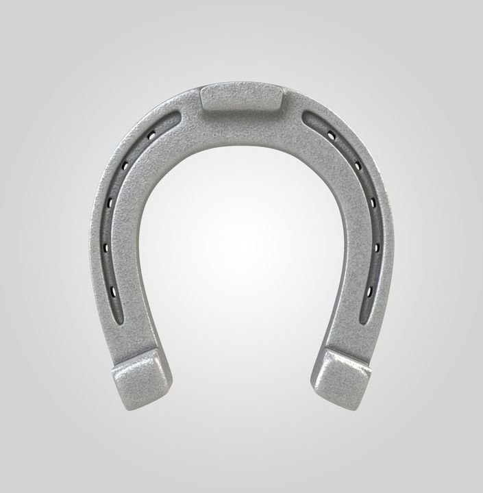 A silver horseshoe with nail holes sits against a light gray background.