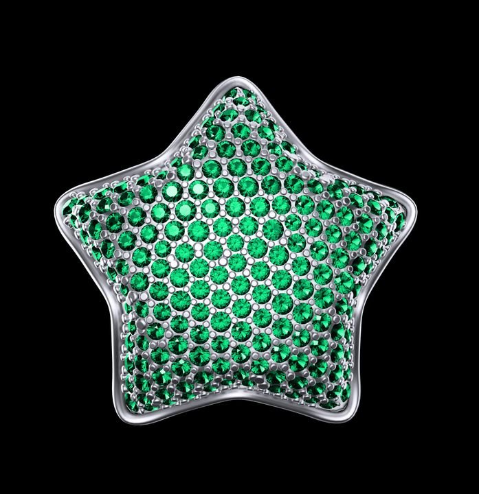 A silver star-shaped brooch sparkles with numerous green gemstones set in a dense, glittering pattern against a black background.