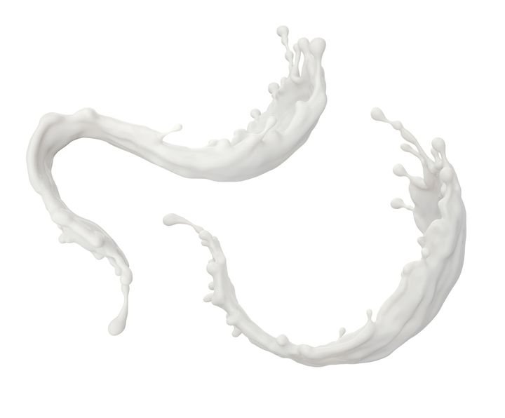 A dynamic splash of white milk forms elegant curves against a clean white background.