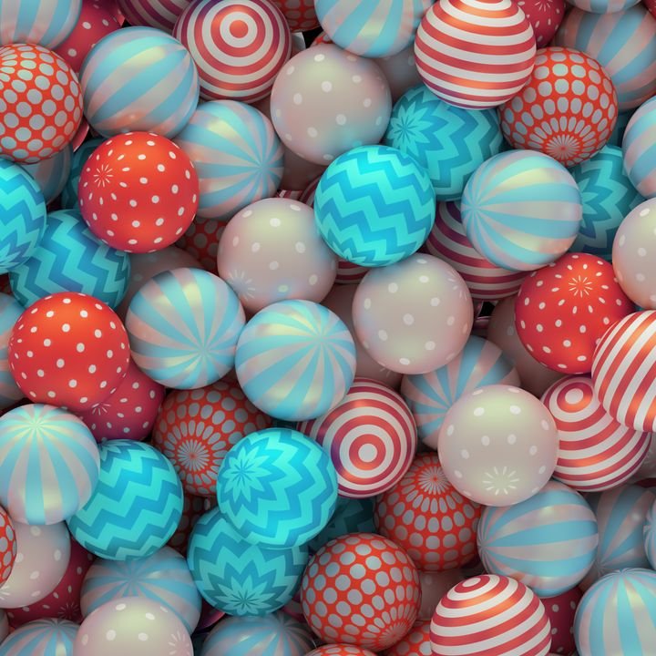Colorful patterned spheres fill the frame with vibrant designs in red, blue, and white.