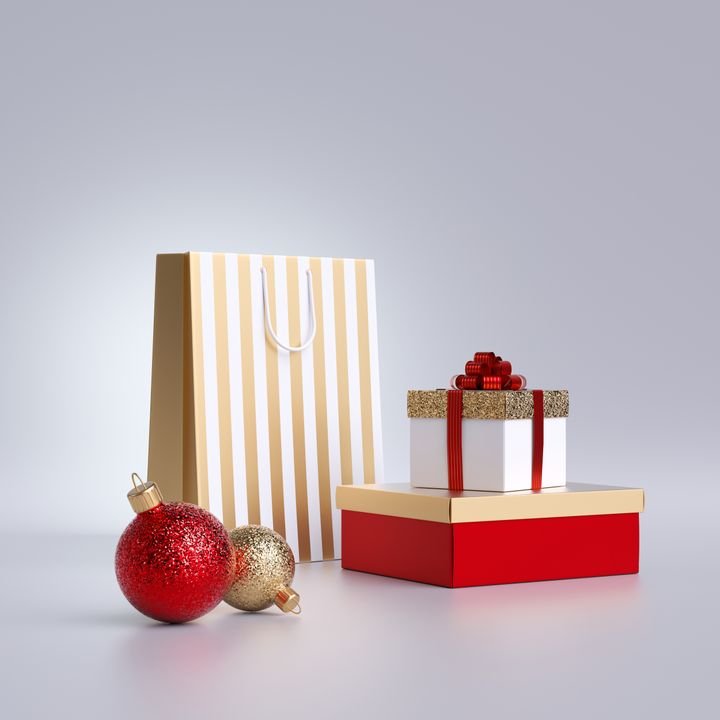 3d Christmas commercial mockup. Shopping bag, glass balls ornaments, wrapped gift box, isolated on white background. Blank pedestal, empty space. Cylinder platform. Product display for advertisement.