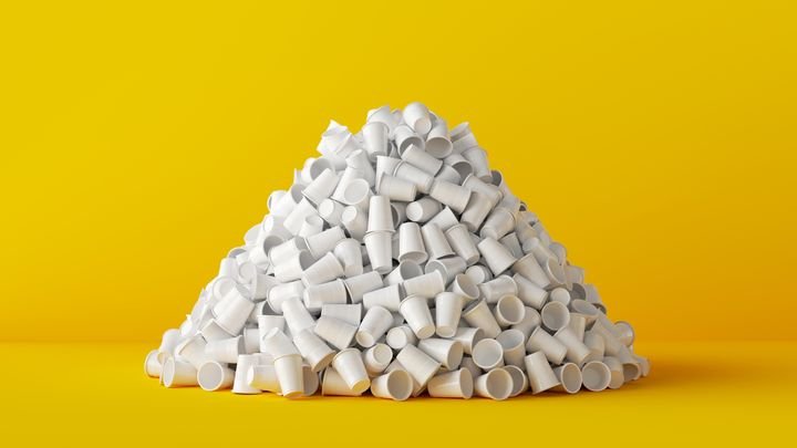 3d render, pile of used plastic cups isolated on yellow background. Garbage sorting concept. Worldwide ecological problem