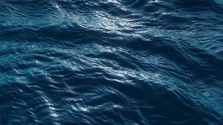 3d rendering, abstract background of wavy water surface with gentle ripples catching the light. Deep blue sea wallpaper