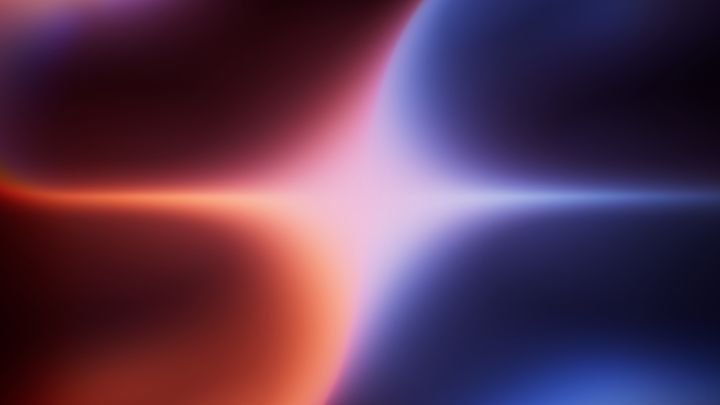 vibrant abstract background featuring a blend of red, orange, and blue hues with a soft gradient effect. Grainy film effect with noise. Mystical ambient wallpaper