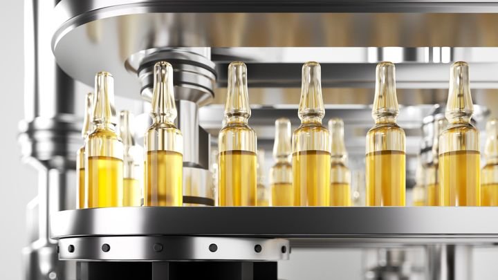 realistic 3d render macro. Pharmaceutical production of glass ampoules filled with yellow liquid, moving on an automatic conveyor line. Sterile manufacturing process