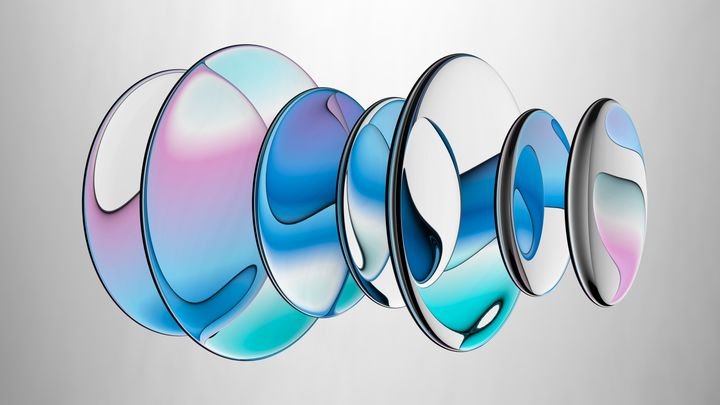 A composition of colored crystal lenses refracting colored iridescent gradients. 3d illustration of oval glass pieces.