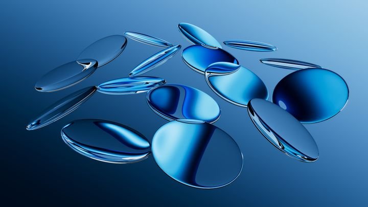 3d rendered round glass shapes with a reflective surface, float on air. Futuristic abstract background featuring blue lenses. Minimalist aesthetic concept