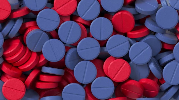 3d render, red blue pills falling on black background, macro animation, pharmacy supplements and drugs. Animation with alpha channel