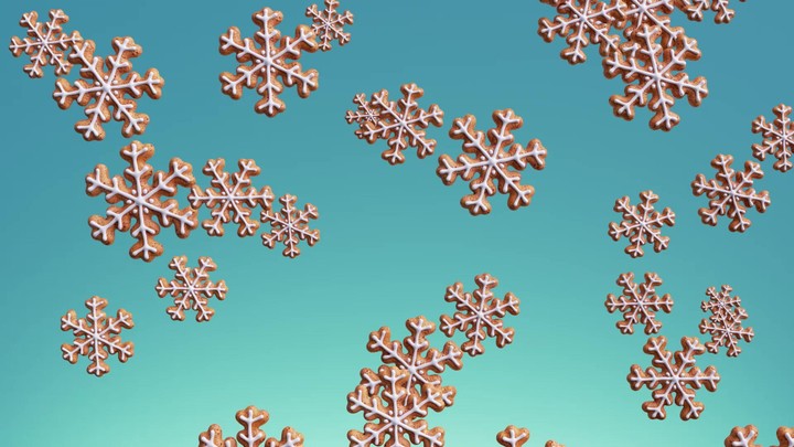3d winter holiday animation with Christmas biscuits in the shapes of snowflakes with icing, gingerbread cookies spinning and falling, isolated on blue background.