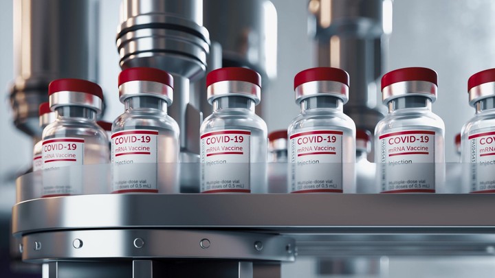 Sars-COV-2 COVID-19 coronavirus vaccine mass production. Large-scale pharmaceutical processing. Glass ampoules moving on endless conveyor line. Looped 3d animation, repeating action. Front view