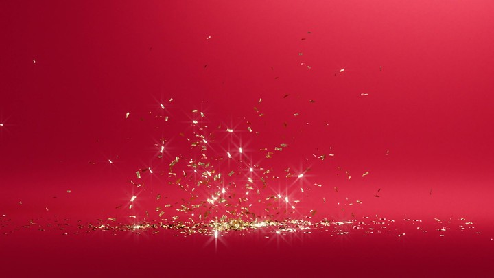 3d animation, golden confetti Christmas party popper, gold glitter particles appear from sides and fall down on red background