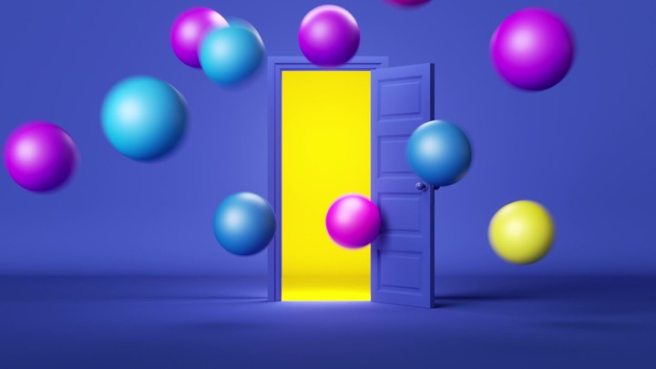 A blue door opens and big multicolored balloons and balls fly out. A bright yellow light shines from the door. 3D animation of a party or celebration