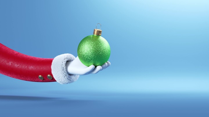 3d animation, funny toy Santa Claus arm appears from the left, holds and flips green glass ball ornament, isolated on blue background. Christmas holiday wallpaper, festive animated greeting card