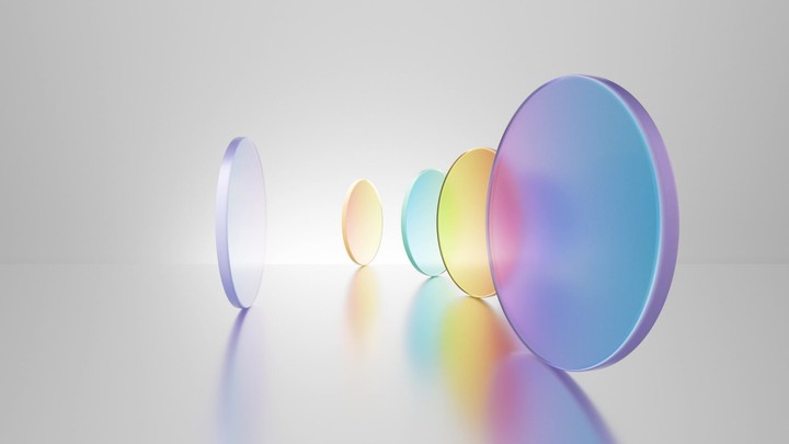 Multicolored translucent round glass blocks spin and rotate on a white background. 3d cycled animation