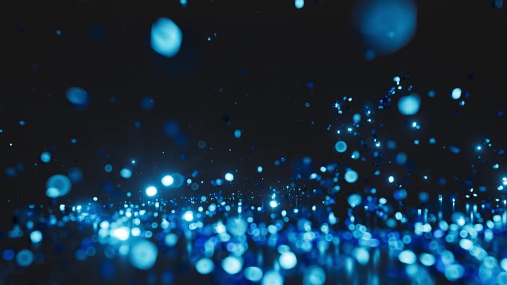 3D animation. Abstract background of glitter and bokeh lights. Blue sparks follow a curved trajectory towards the camera, sparkling and fading into the dark, leaving magical and enchanting feel.