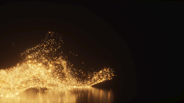 Abstract background with gold particles, shining stars, dust, bokeh, and glitter.
