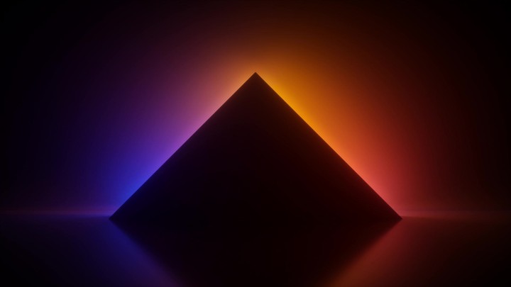 cycled 3D animation of a black geometric silhouette lit from behind by smoothly changing neon colors. Blank triangular frame with copy space. Soothing and relaxing atmosphere. Meditation vibe