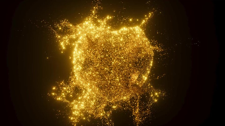 A sphere of golden sand particles dispersing in all directions in a stream of wind. 3d render animation.