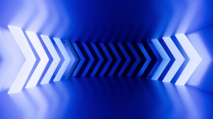 looping animated 3d background. Arrows glow with bright white neon light, flashing and pointing right direction, meet in the center inside the blue room. Game environment in virtual reality