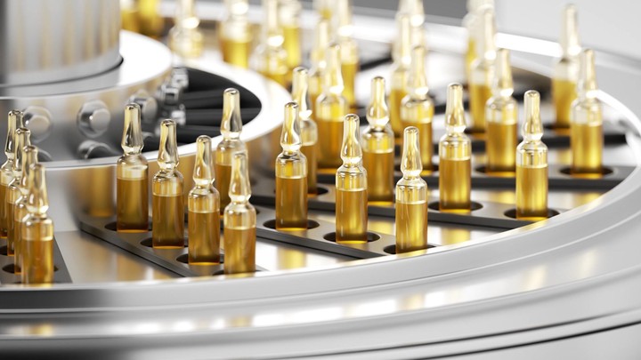 Pharmaceutical production. Glass ampoules filled with yellow liquid, moving along an automatic conveyor line, depicting the drug manufacturing process. Looped 3d animation