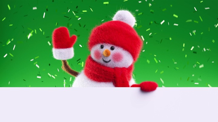 Friendly wool‑felt snowman rises from below a white surface; confetti rains in the back, perfect for holiday lower‑thirds and messages.