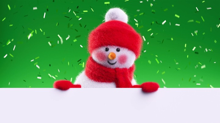Shy needle‑felted snowman peeks over the banner while celebratory confetti flickers on green. Clean seasonal opener with copy space.